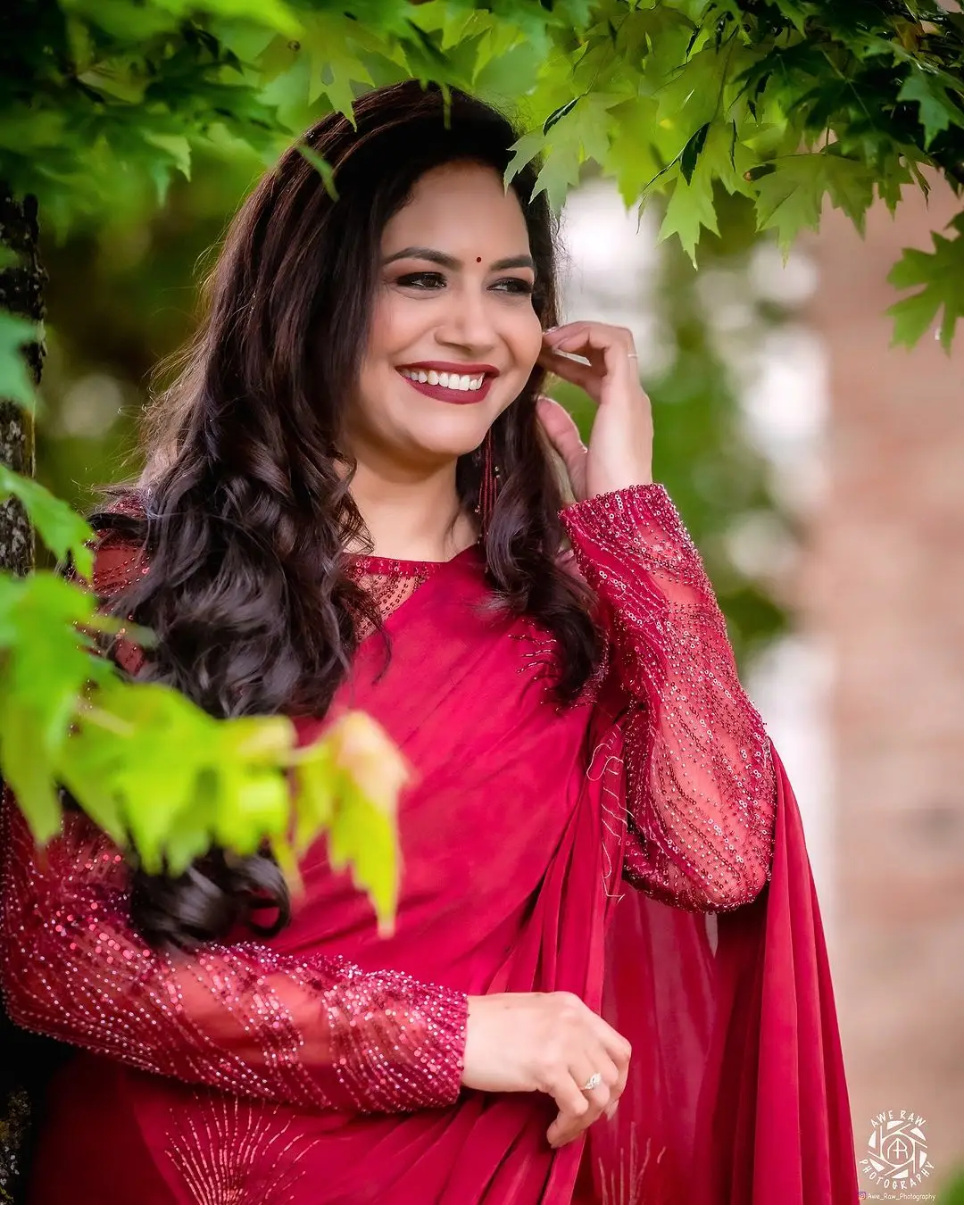 Telugu Singer Sunitha Stills In Maroon Saree Blouse